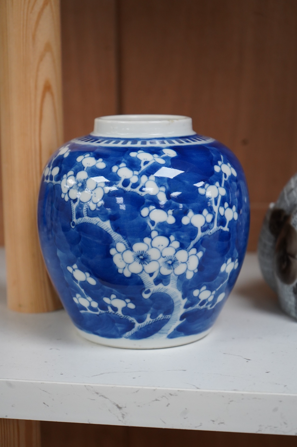 A 19th century Chinese blue and white small moon flask together with a later jar and a Portugese porcelain copy of a Chinese export cat, largest 19cm high